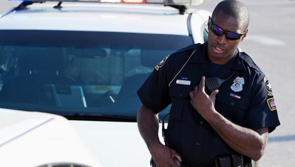 Police officer talking on radio