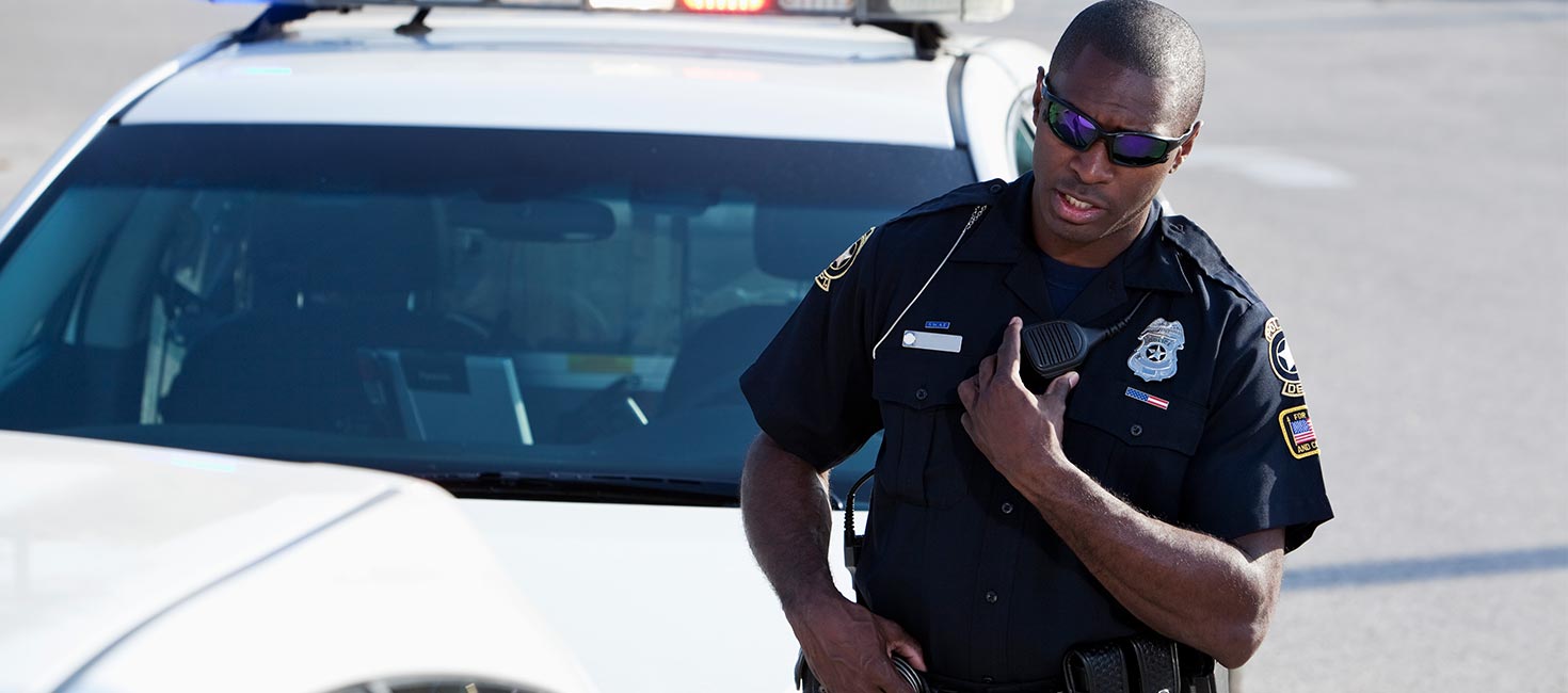 Police officer talking on radio