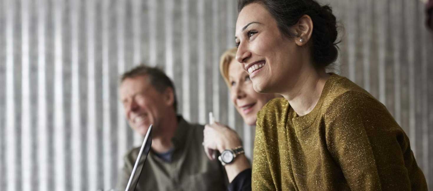 AS in Liberal Arts graduates conversing and smiling